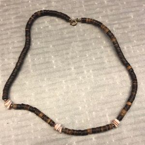 Brown wooden necklace with pooka shells